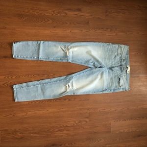 Light blue skinny jeans knee cuts